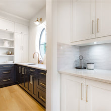 Load image into Gallery viewer, Diversa square edge nickel pulls on white and blue cabinets
